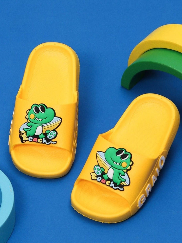 Creative display of Yellow Bee boys' sunny yellow beach sliders with frog design.