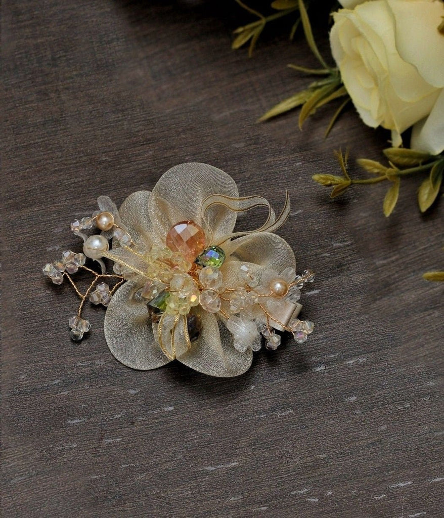 Yellow Bee's off white charming daisy hair clip presented elegantly, showcasing its detailed embellishments.