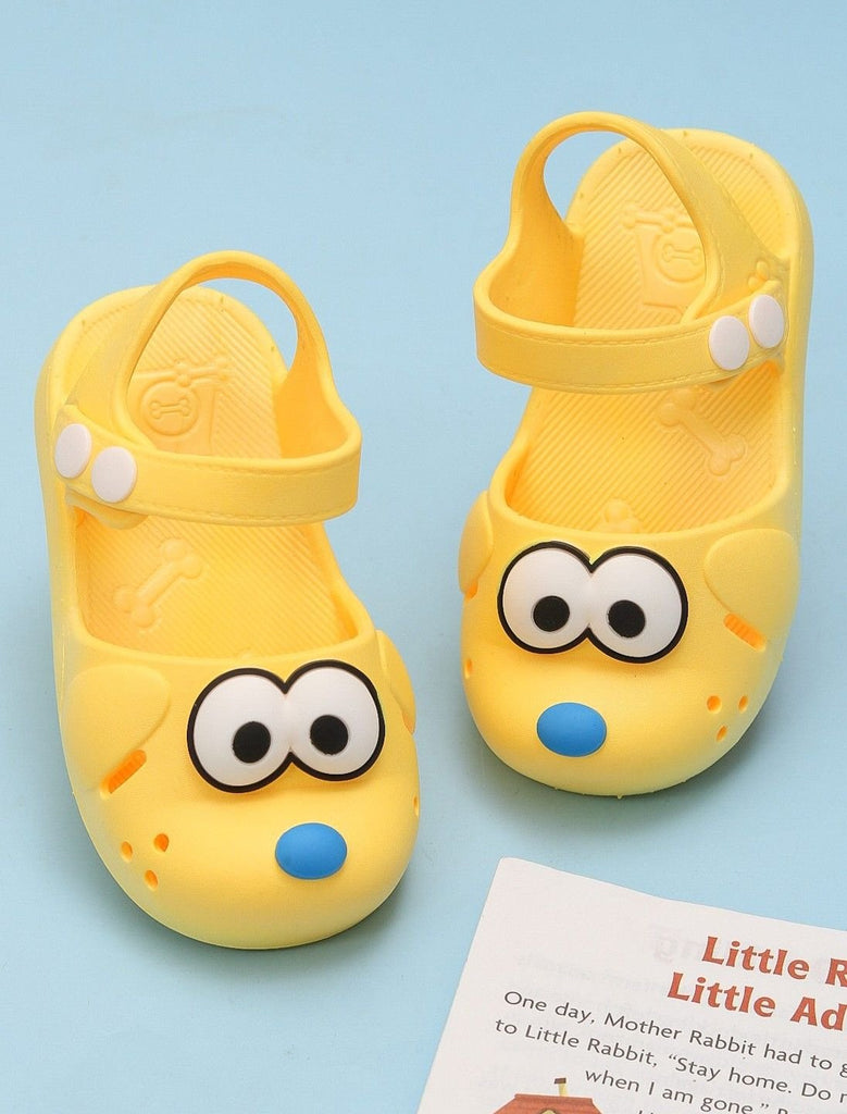 Creative display of kids' yellow cartoon character sandals against a summer backdrop.