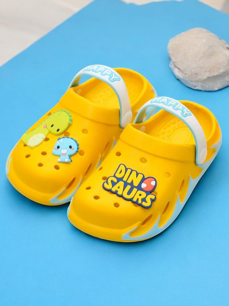 "Side view of bright yellow kids' clogs with a fun dinosaur design, ready for action and exploration.-1.