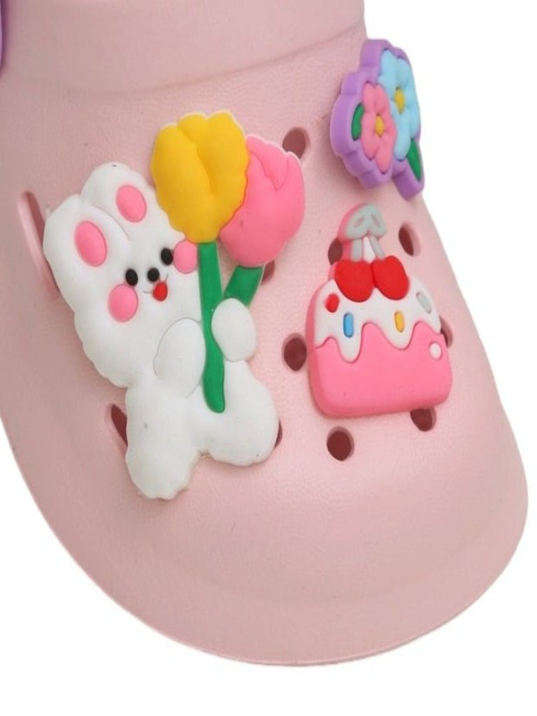 Close-Up of Pastel Pink Clogs with Colorful Treat Charms