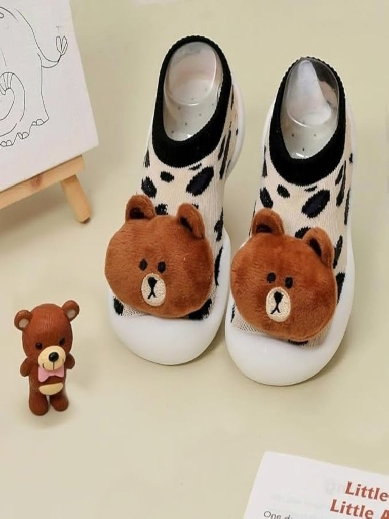 Creative view of Yellow Bee Teddy Stuffed Toy Anti-Skid Rubber Sole Shoe Socks for Boys on a light background with teddy toy.