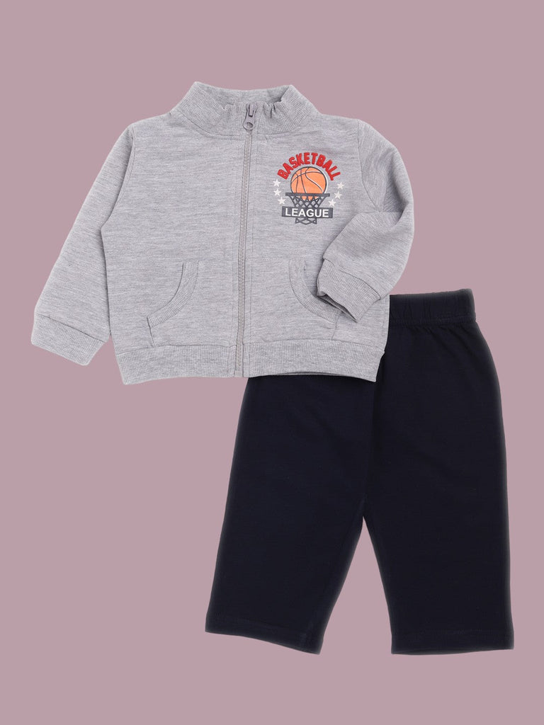 A grey tracksuit top with basketball print and navy pants displayed together.