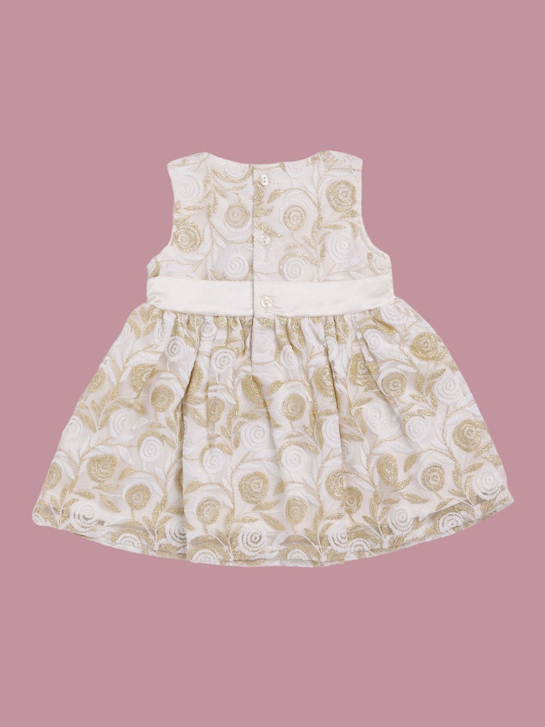 Back view of Toffyhouse baby girl white and gold floral dress with satin bow.