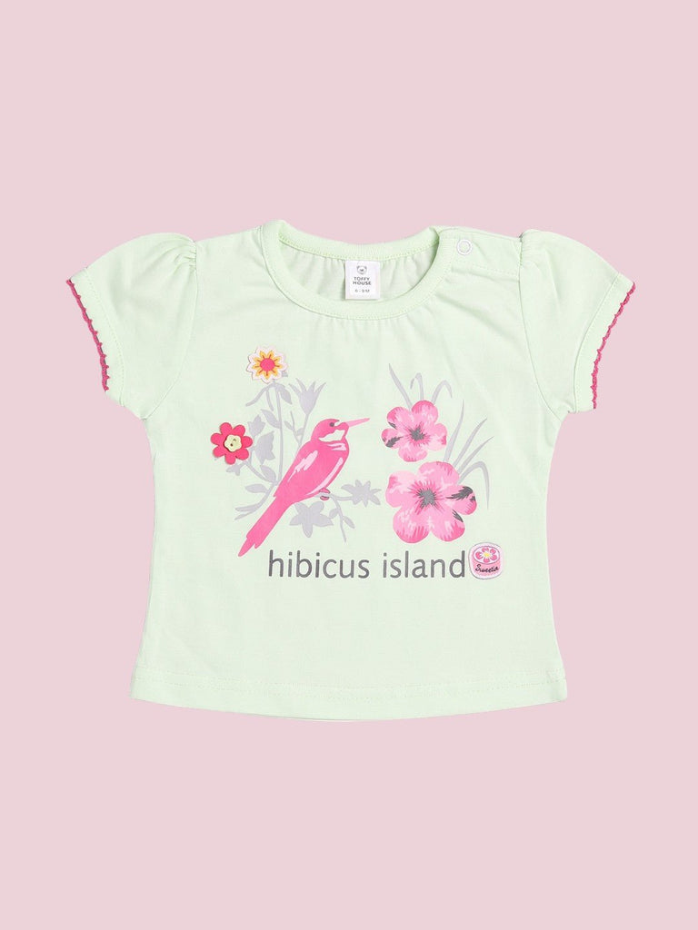  Front view of the mint green T-shirt with a ‘Hibiscus Island’ print from Toffyhouse.