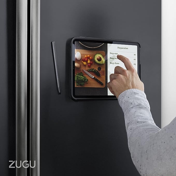This image likely showcases the case's magnetic mounting feature, being used on a fridge, which is a unique and convenient way to display recipes or watch shows while in the kitchen.