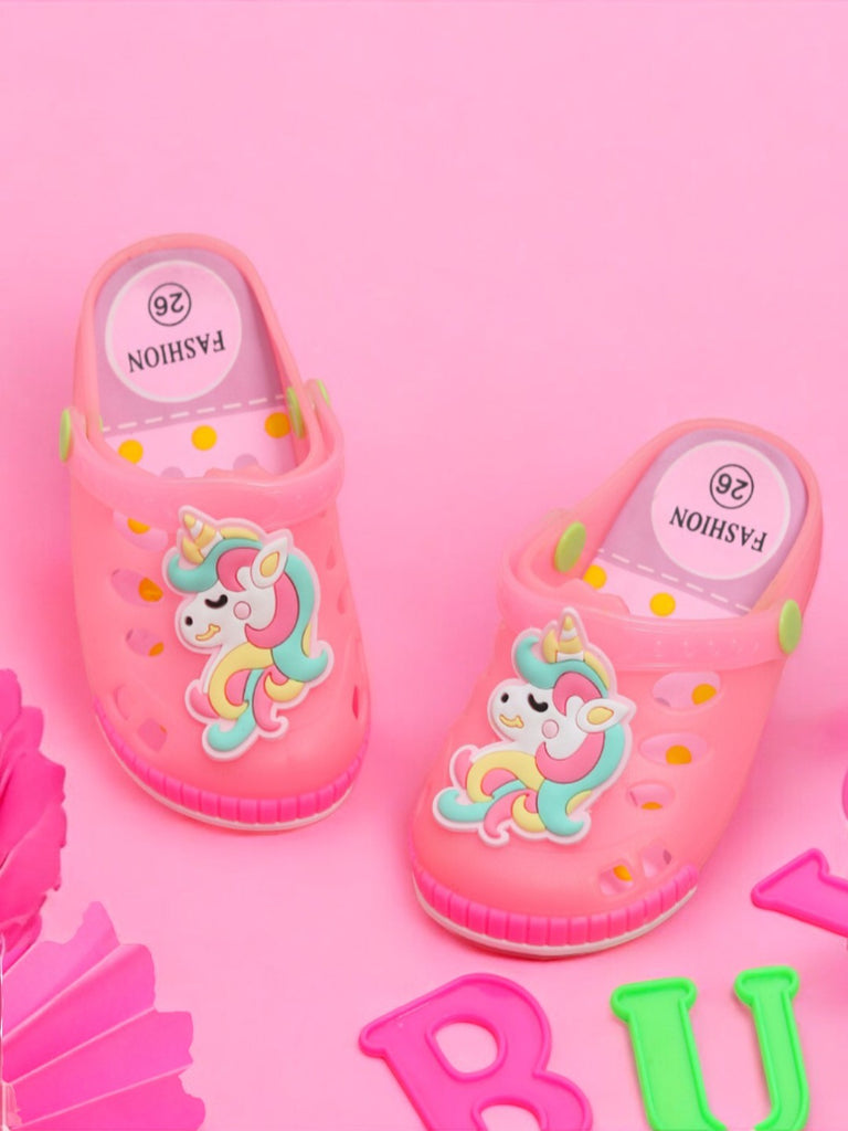 Pair of Pink Unicorn LED Clogs for Girls alongside colorful letter blocks.