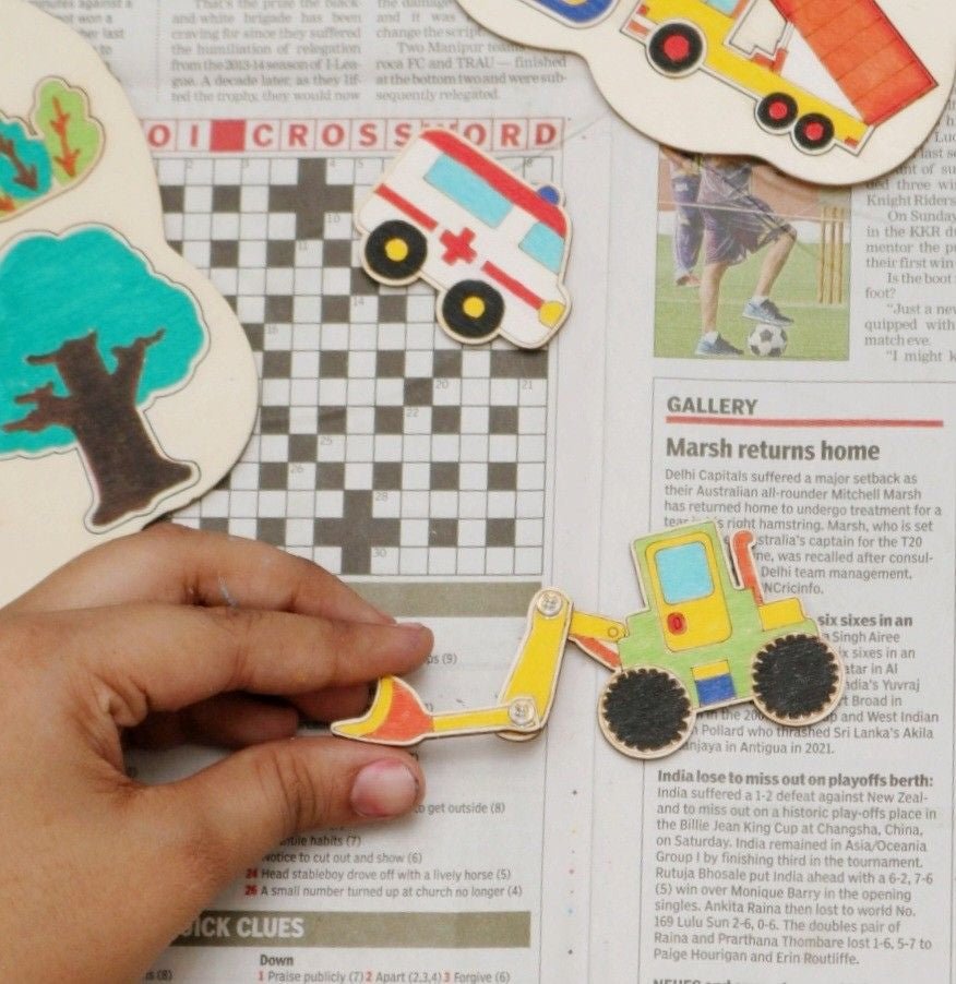 Child engaging with the Yellow Bee Urban Vehicles Adventure DIY Light Box Kit during assembly.