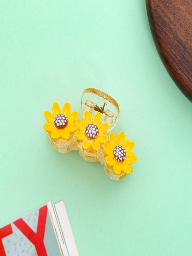  Vibrant Sunflower Hair Claw Clip – Yellow on green background with a wooden coaster.