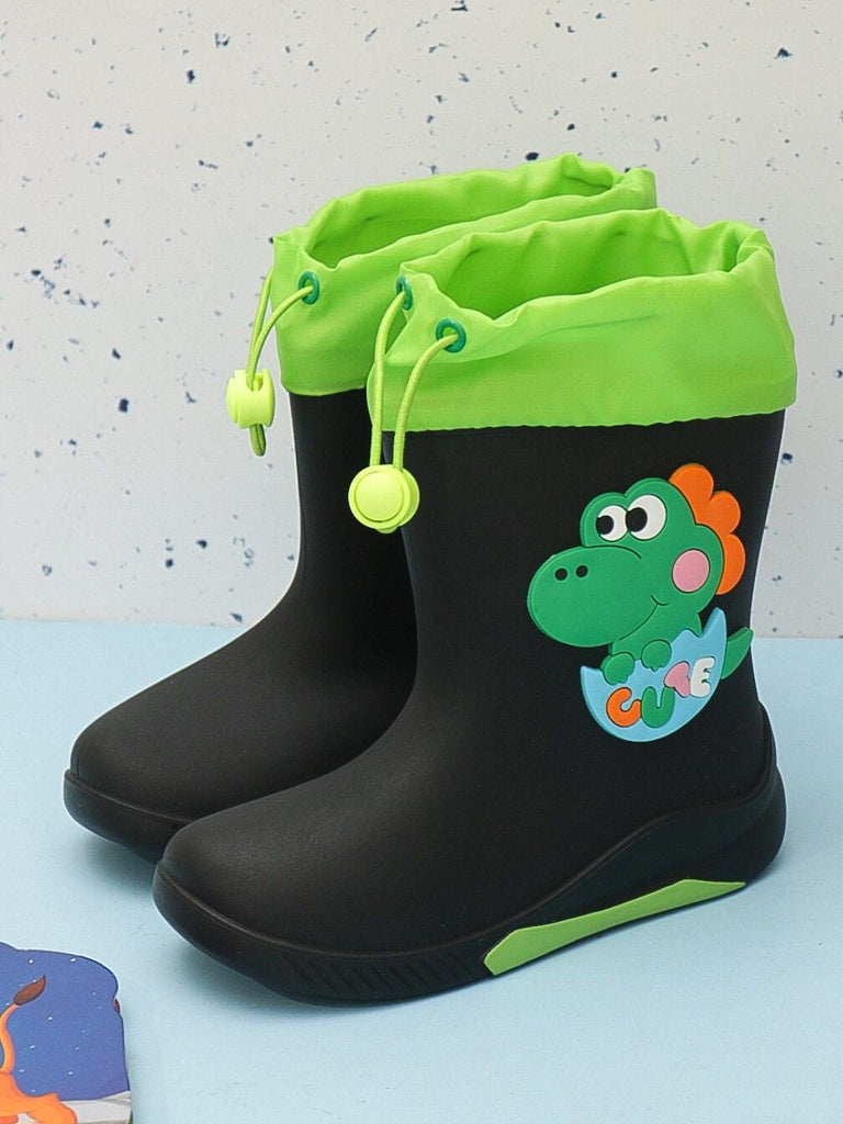 Creative display of Yellow Bee's boys' rain boots with green dinosaur design