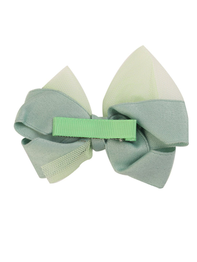 Back view of the whimsical pastel green tulle hair bow clip for girls featuring a secure metal clip by Yellow Bee