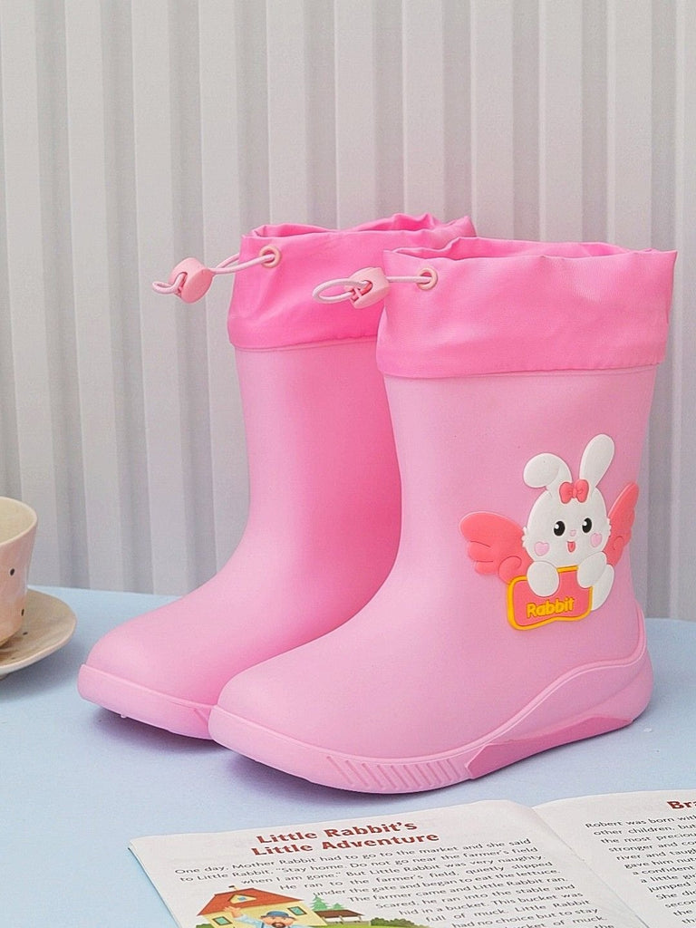 Creative display of Yellow Bee's Pink Bunny Rain Boots for Girls showing off the playful design.