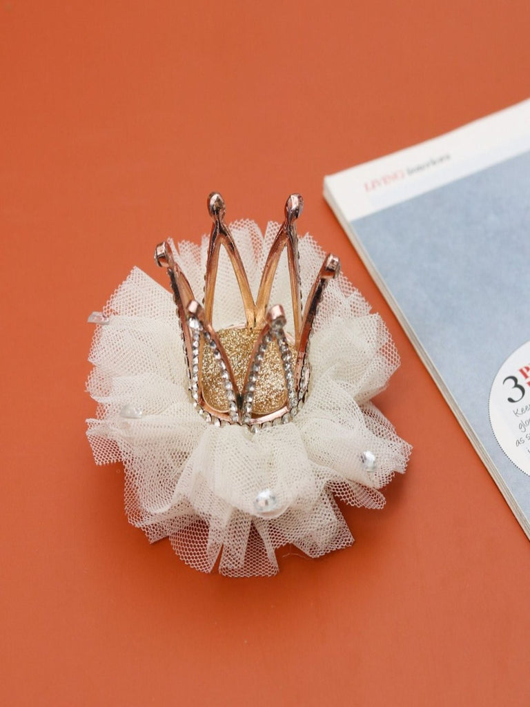 Yellow Bee's White Crown Hair Clip in a creative setup, highlighting its whimsical charm.