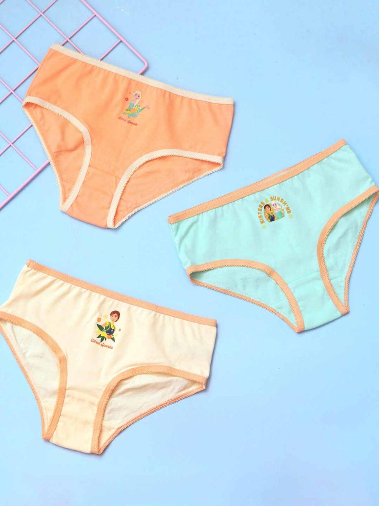 Set of three Disney Frozen girls’ cotton briefs in peach, mint, and cream with Elsa and Anna prints, front view.