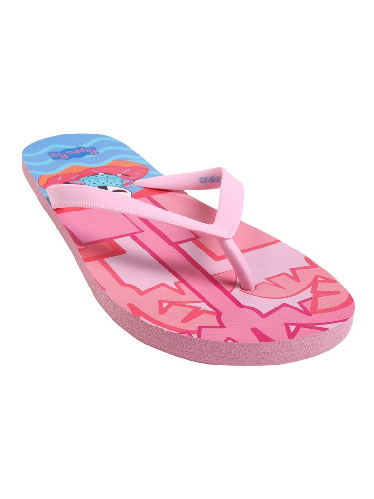 Close-up of a girl's Peppa Pig flip-flop with a pool party print, focusing on the detailed character design and the texture of the sole for slip resistance.