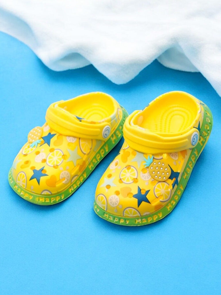 Yellow Kids' Clogs with Citrus Fruit and Star Patterns on a Bright Summer Background.