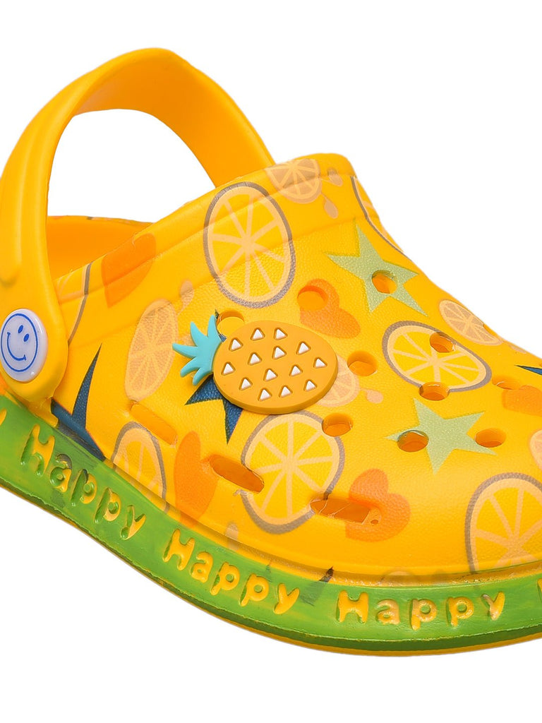 yellow-kids-clogs-with-citrus-fruit-and-star-patterns-close -up view.