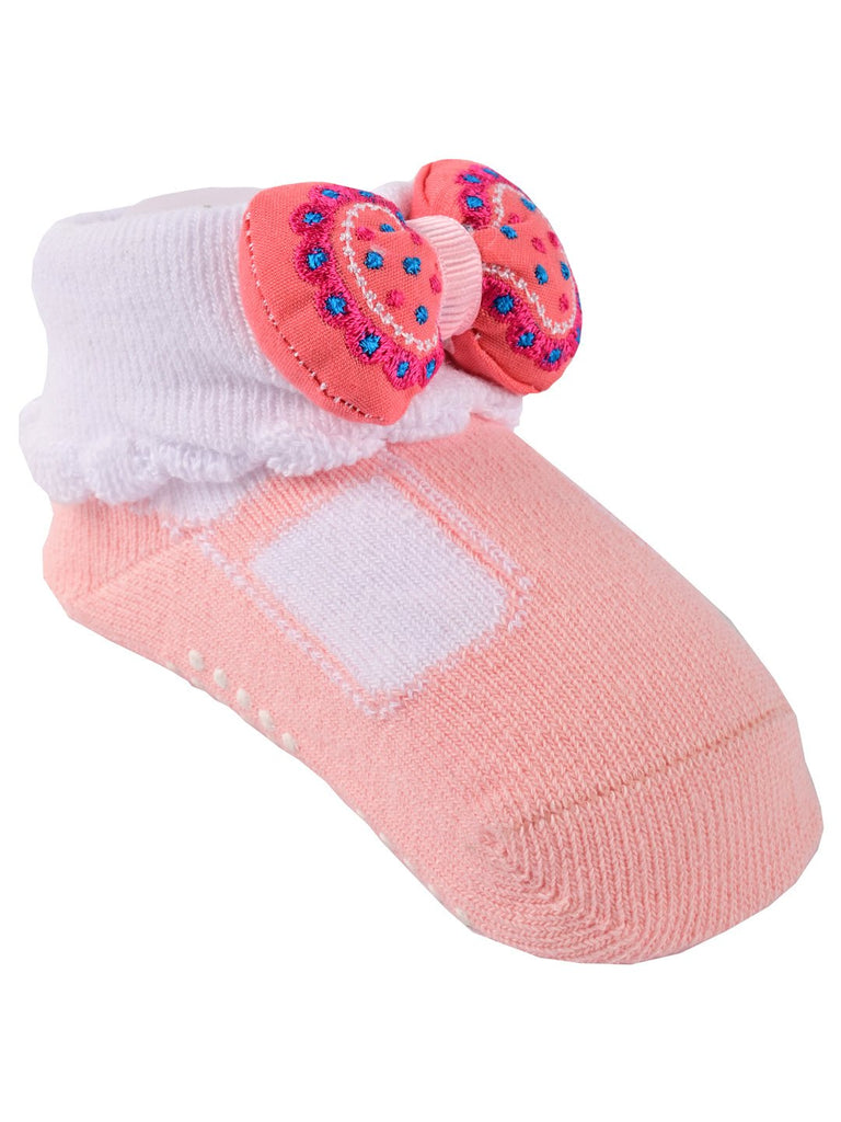 Side view of pink and white socks with sparkling bow detail and frilly trim
