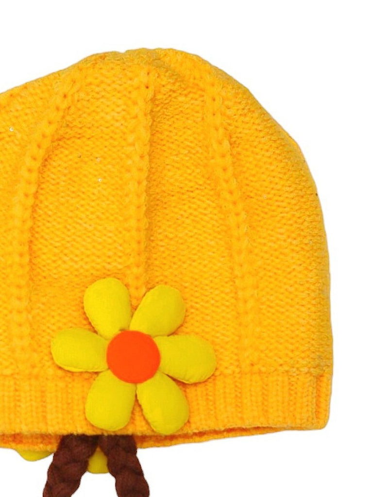 Close-Up of Girl's Winter Hat with Yellow Knit Flower and Braided Tassels