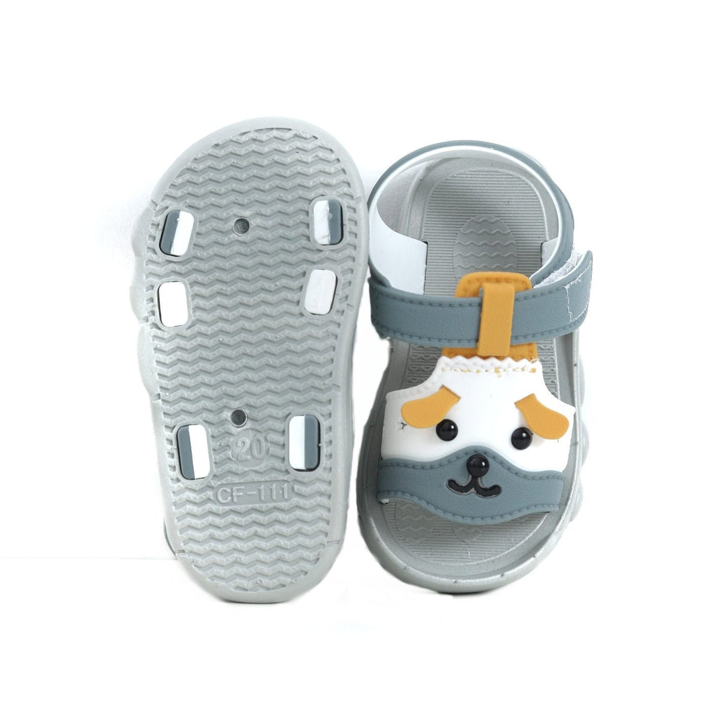 Bottom view of grey puppy sandals showcasing the anti-slip tread and playful paw prints
