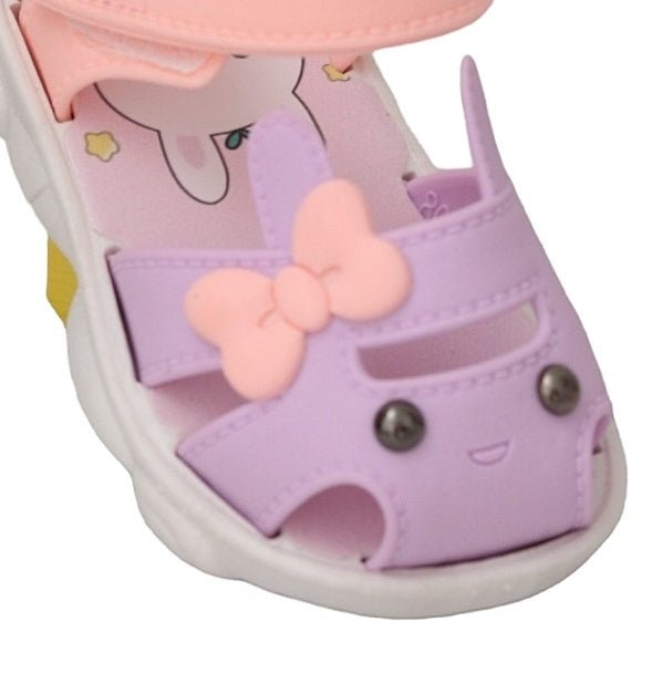 Charming detail of the purple bunny face on a toddler sandal with a delightful bow