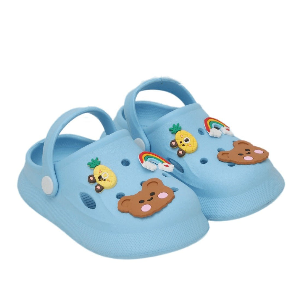 Blue clogs with playful animal and rainbow motifs on a blue background
