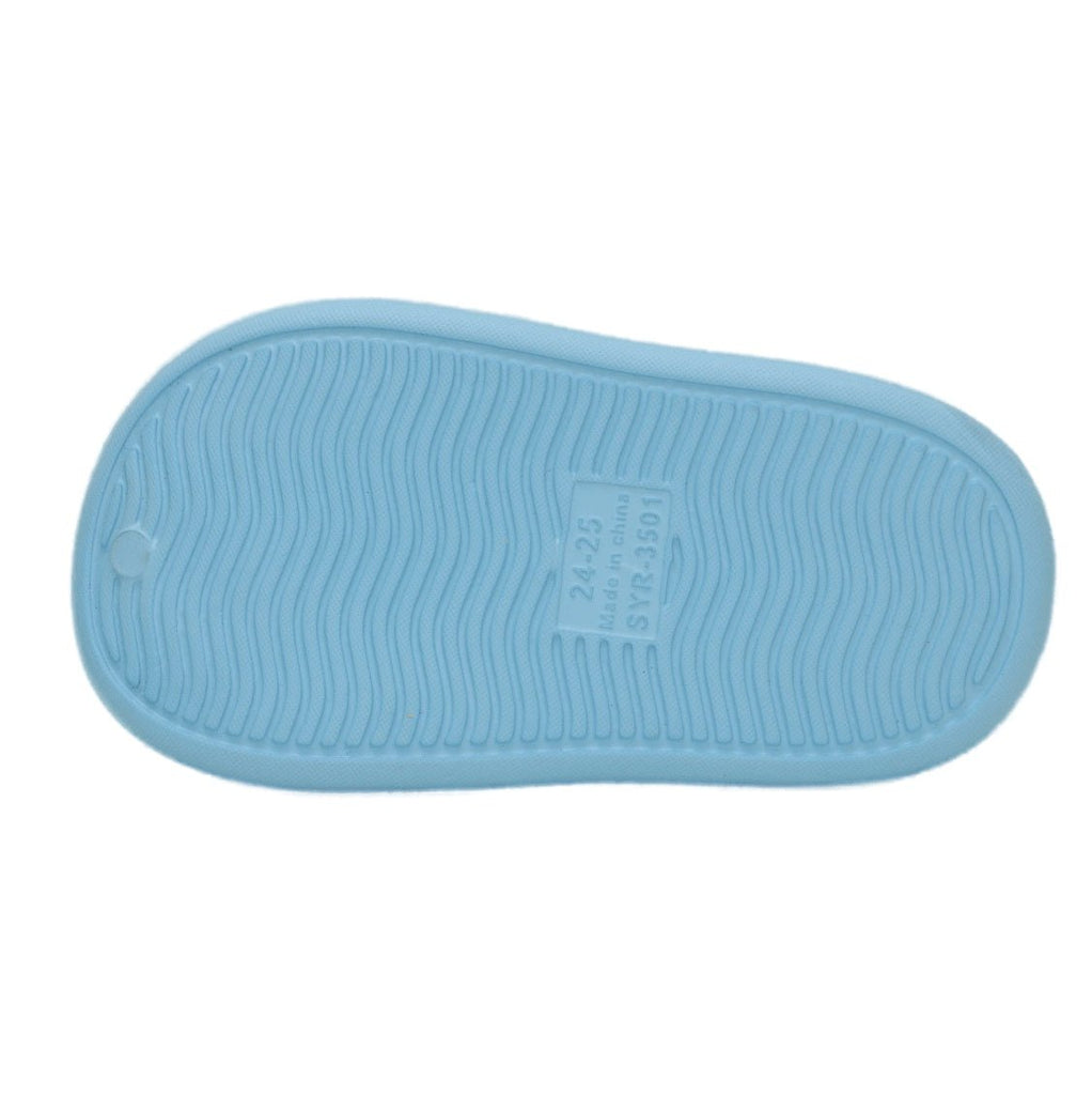 Bottom view of a child's blue clog displaying the grippy tread pattern