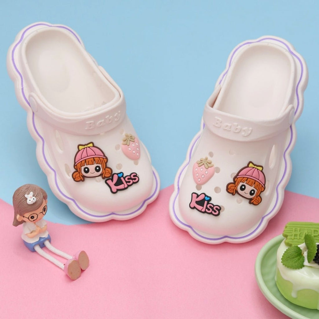 Pair of white Strawberry and Doll Motif Clogs for toddlers against a blue background