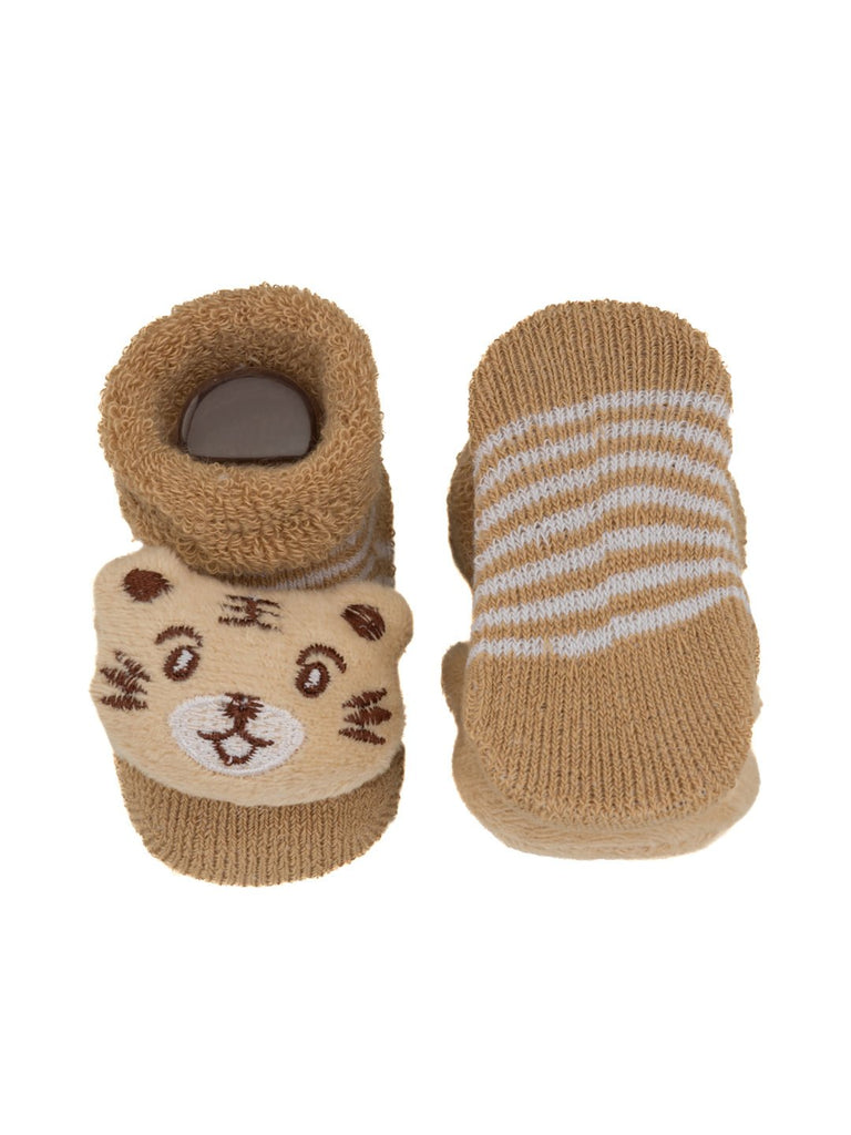 Tan infant socks with a tiger stuffed toy, showing off the striped sock pattern and soft texture.