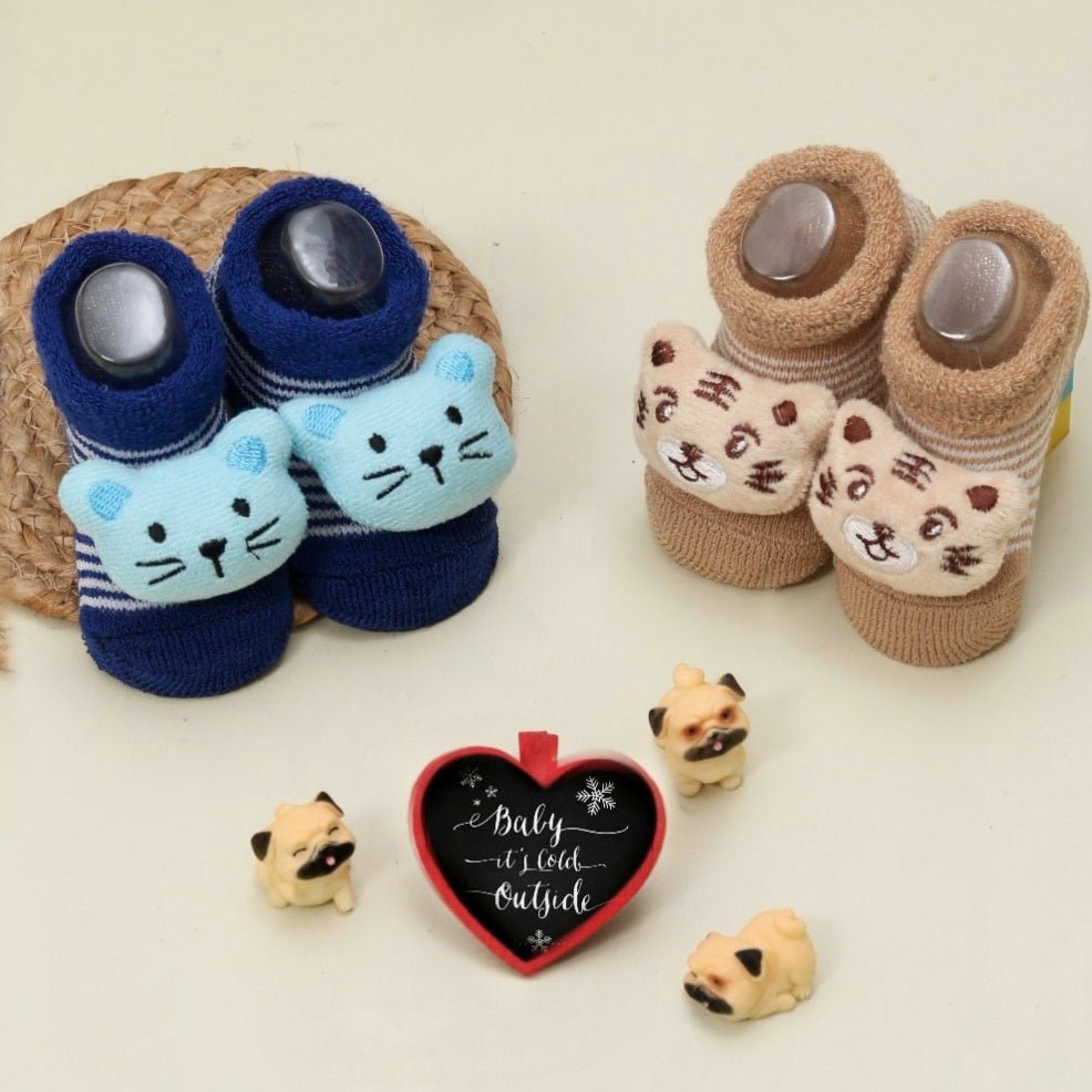 Infant's tiger and mouse stuffed toy socks set with cozy cuff design on a playful background.