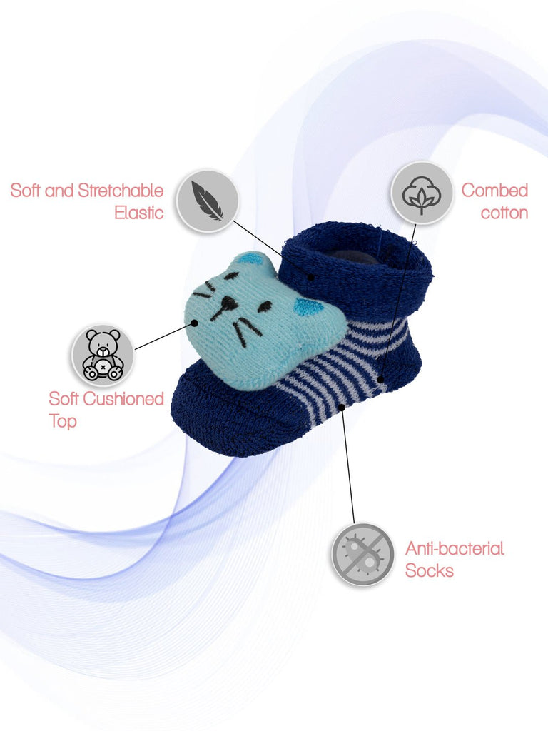 Detail of infant's blue mouse toy sock featuring soft elastic, combed cotton, and a cushioned top.