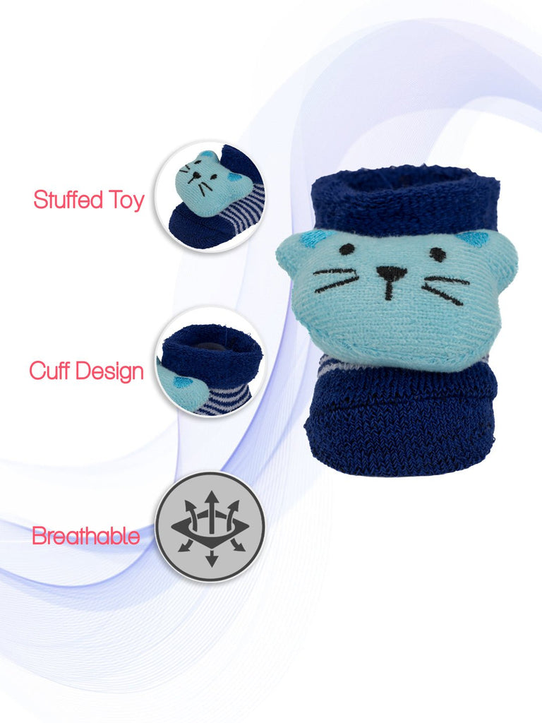 Close-up of blue infant socks with a stuffed toy mouse, highlighting the breathable fabric.