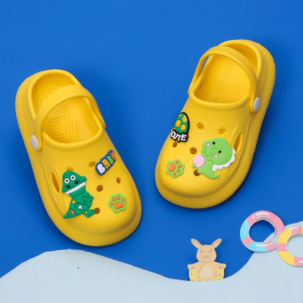 Yellow clogs with dinosaur and ice cream decorations for boys by Yellow Bee.