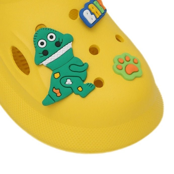 Adorable dinosaur detailing on children's yellow clogs, ideal for daily wear and play.