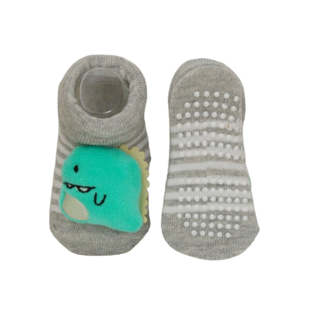 Grey socks with a cute dinosaur design for baby boys by Yellow Bee, featuring anti-skid bottoms for safe adventures.