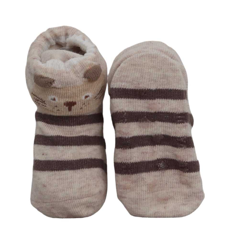 Pair of bear-printed anti-skid baby socks in brown and white stripes laid flat by Yellow Bee.