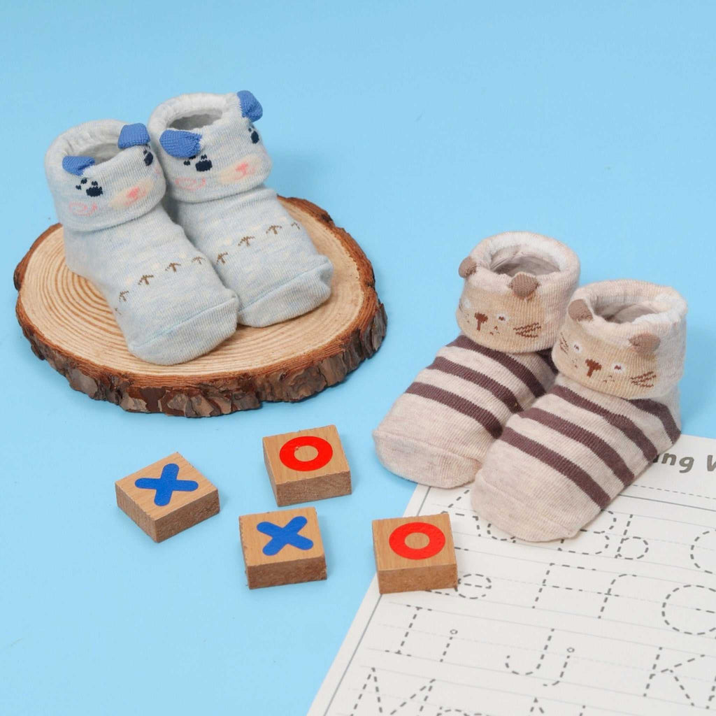Blue and white baby socks with animal printed and anti-skid design by Yellow Bee.