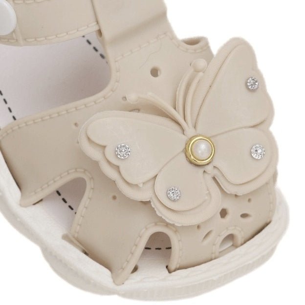 Close-up of Butterfly Decoration on Beige Toddler Sanda