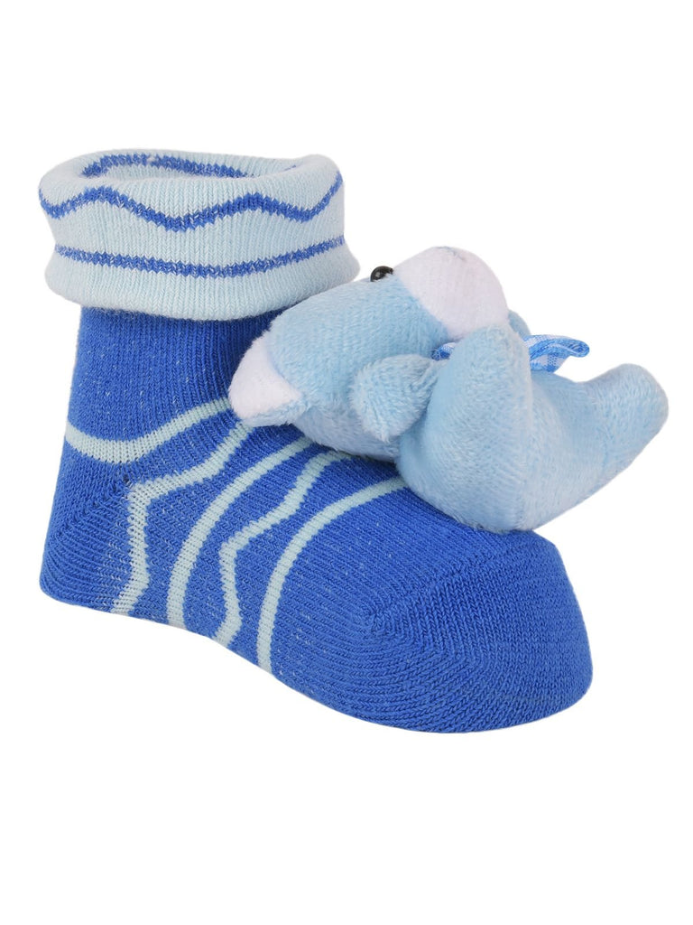 Top and bottom view of baby blue teddy bear socks with non-slip dots on the sole
