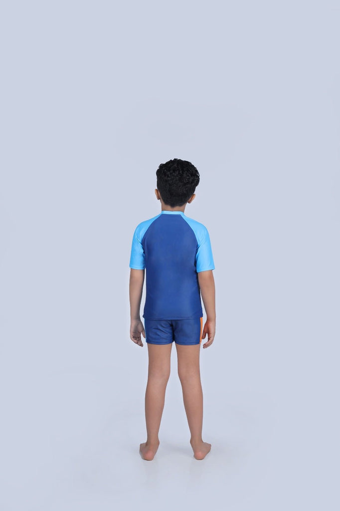 Back view of a child wearing the Blue Car Print Swimsuit by Yellow Bee