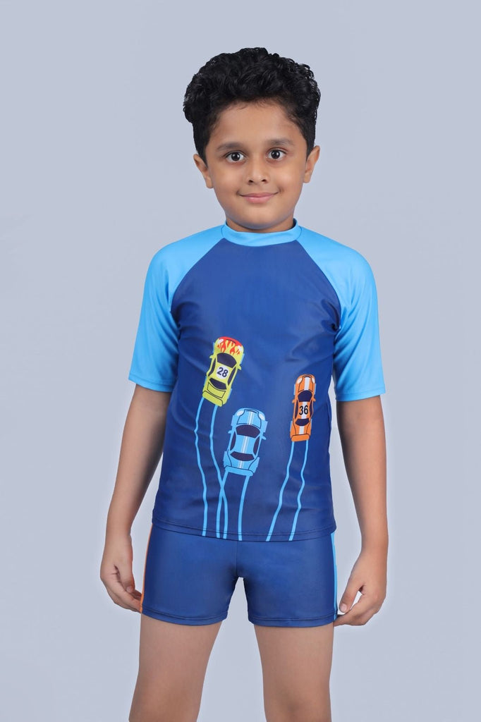 Front view of a child ready for swimming in Yellow Bee's Blue Car Print Swimsuit