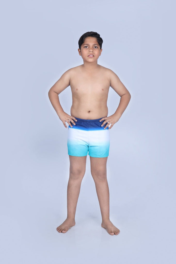 Front view of a boy wearing Yellow Bee's Striped and Star Print Swim Shorts