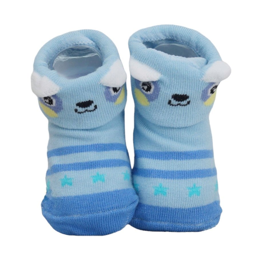 Pair of blue baby socks adorned with cute puppy face and non-slip bottoms.
