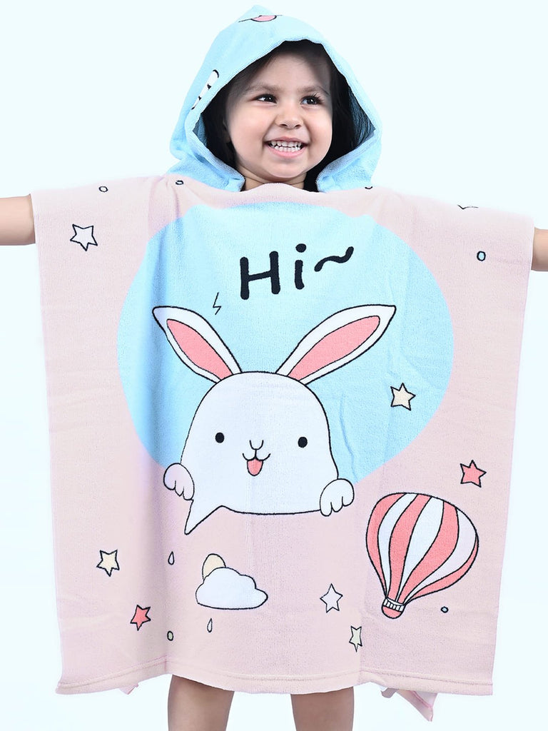 Cute bunny print design on the Yellow Bee hooded poncho towel for girls with a happy child model.