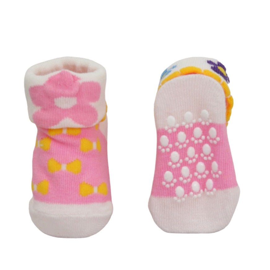 Baby girl socks featuring pink bows and rabbit ears, side and sole view.