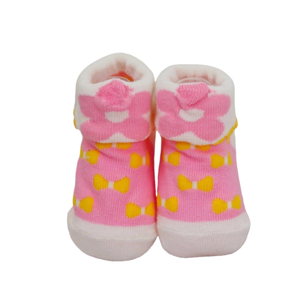 Pink socks with yellow bow design for baby girls with bunny ear details.