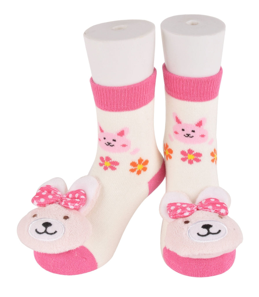 Cuddly pink and white bunny toy socks for infants with floral pattern.
