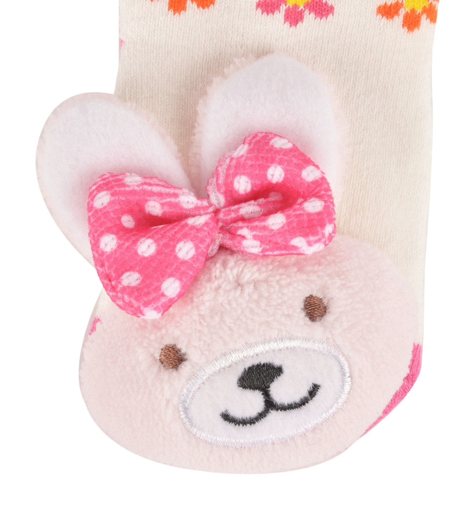 Close-up of the plush bunny face on toddler's stuffed toy socks.