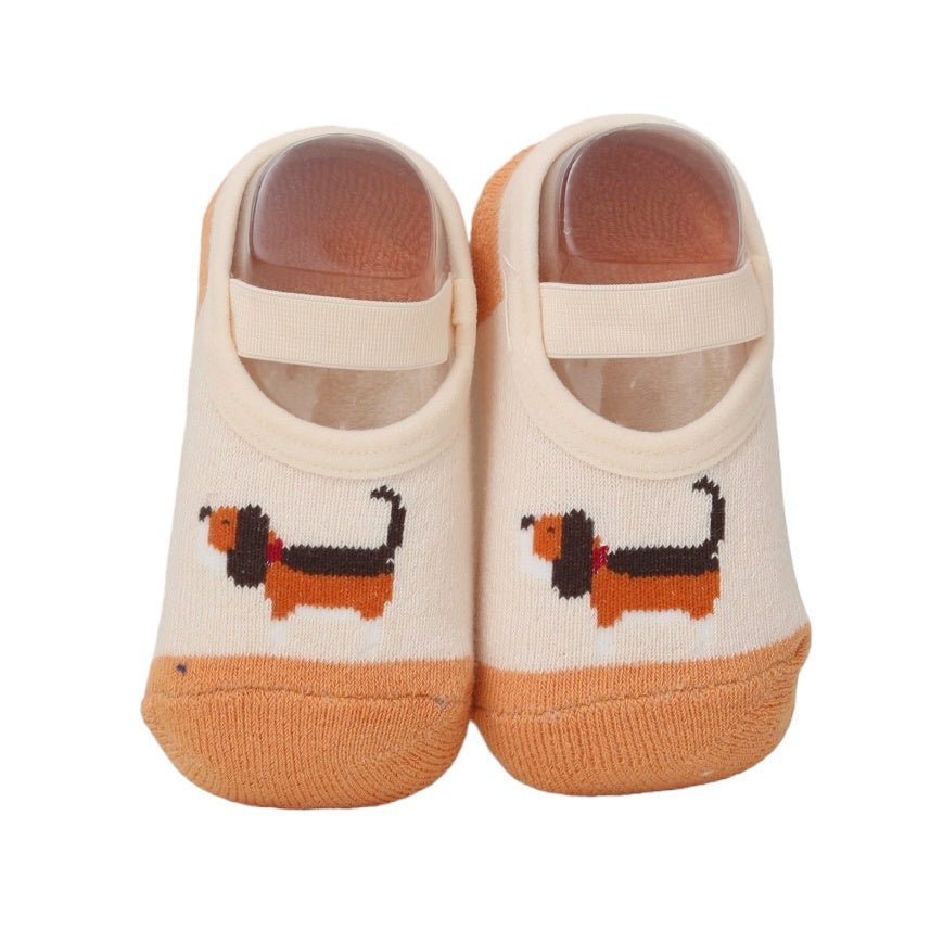Close-up of infant socks featuring an adorable puppy design.
