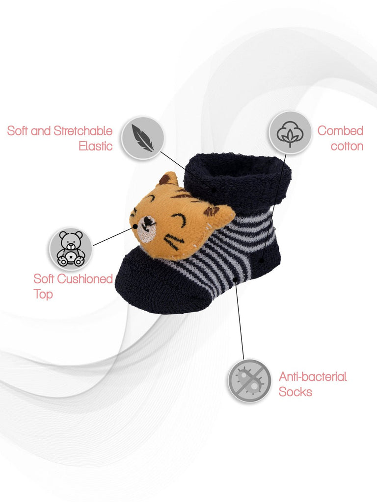 Black socks with stuffed tiger toy for infants, highlighting the soft elastic top.
